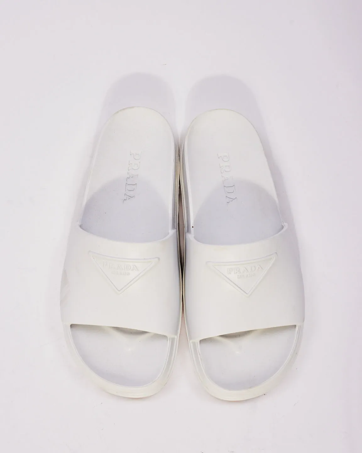 Prada White Rubber Triangle Logo Embossed Lug Sole Slides  - 38